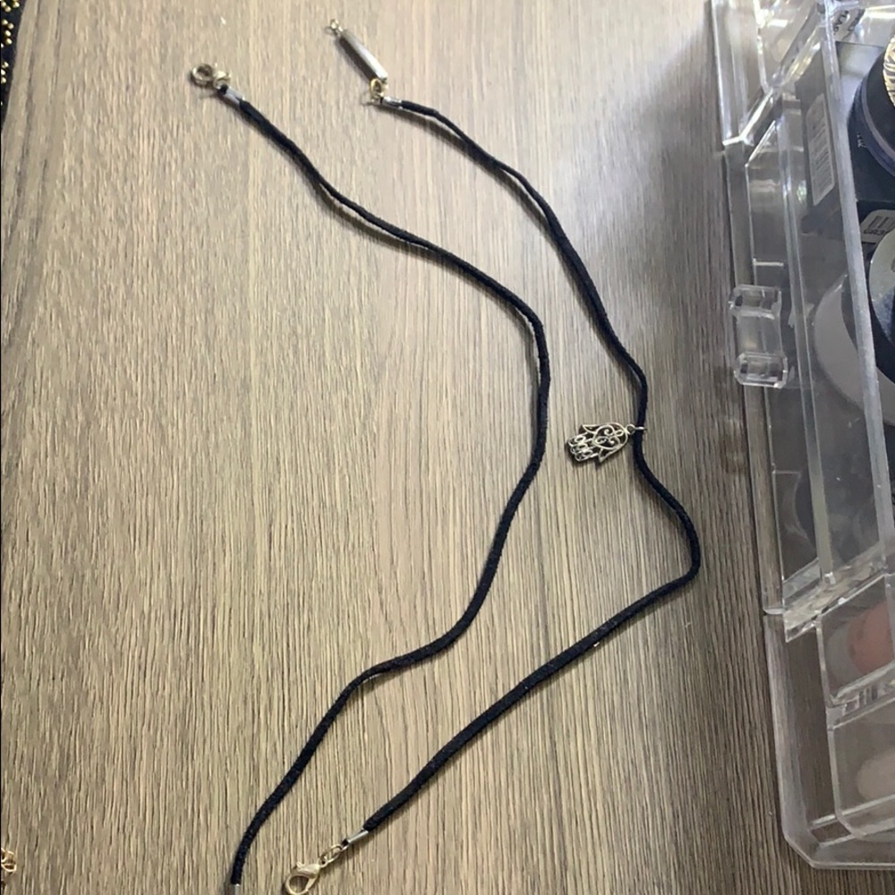 2 think black chockers one with hand